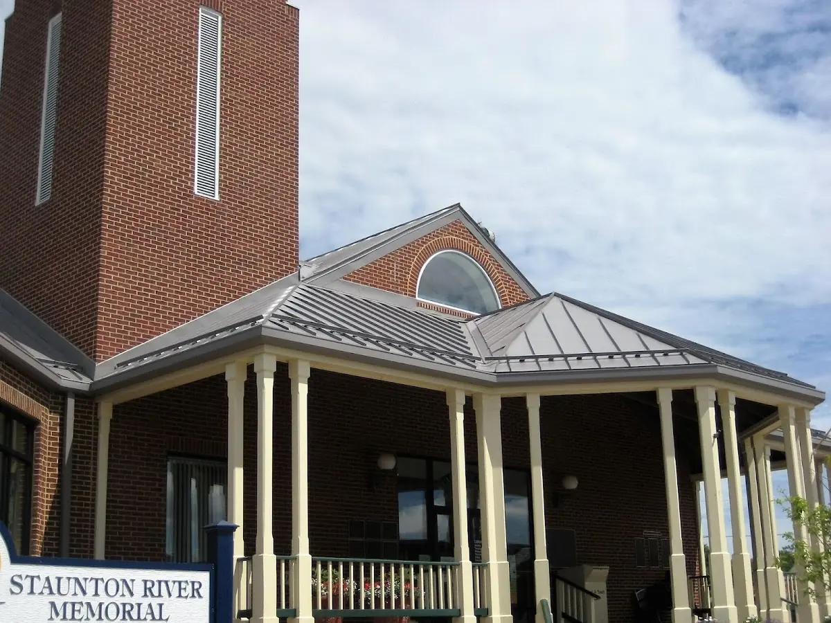 Skilled roofing craftsmen working on a residential roof in Wheeling